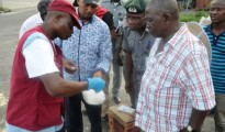 ndlea official tests the drug while the suspect and other      officers watch closely