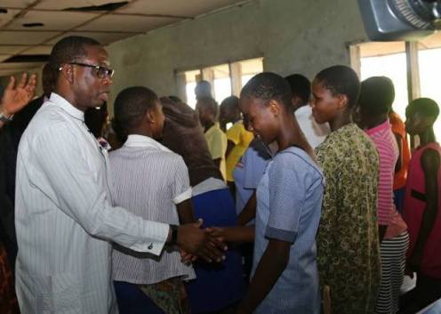Delta State Governor, Dr Ifeanyi Okowa commiserating with some of the students of Chude Girls Model Secondary School, Sapele, affected by the iferno that razed the school's hostel
