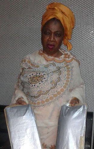 Omolara with the two parcels of cocaine
