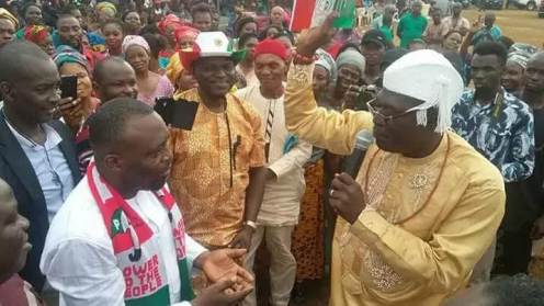 Delta state PDP chairman, Kingsley Esiso, receiving Baxim Chinye in Aniocha area of the state