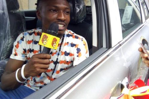 Efe Emmanuel Ejeba in his brand new SUV JEEP