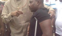 Obarisi Ovie Omo-Agege showing love and care  to a physically challenged fan at Oleh