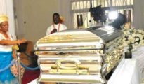 Michael-Ibrus-gold-casket-during-the-burial